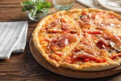 Photo of Delicious hot pizza with meat on table