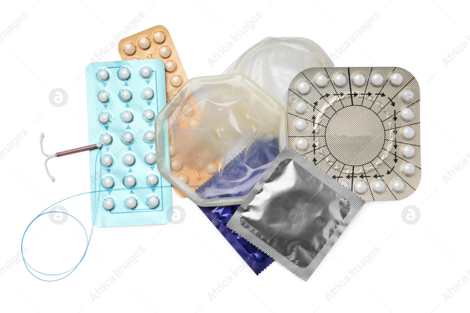 Photo of Contraceptive pills, condoms and intrauterine device isolated on white, top view. Different birth control methods