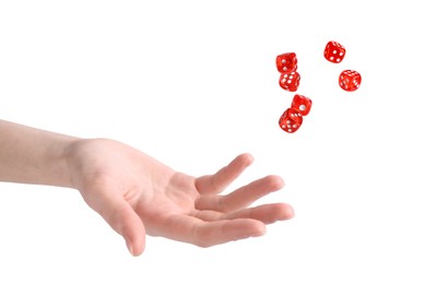 Woman throwing red dice on white background, closeup
