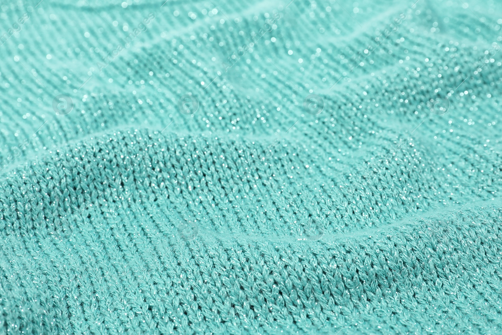 Photo of Texture of cozy warm sweater as background, closeup