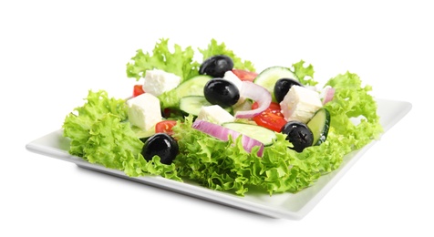 Tasty fresh Greek salad on white background