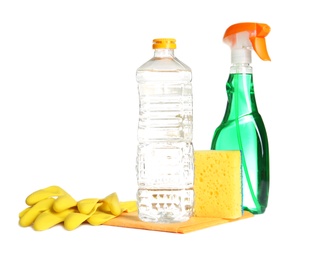 Photo of Composition with vinegar and cleaning supplies on white background