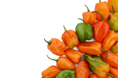 Photo of Different hot chili peppers on white background, top view. Space for text