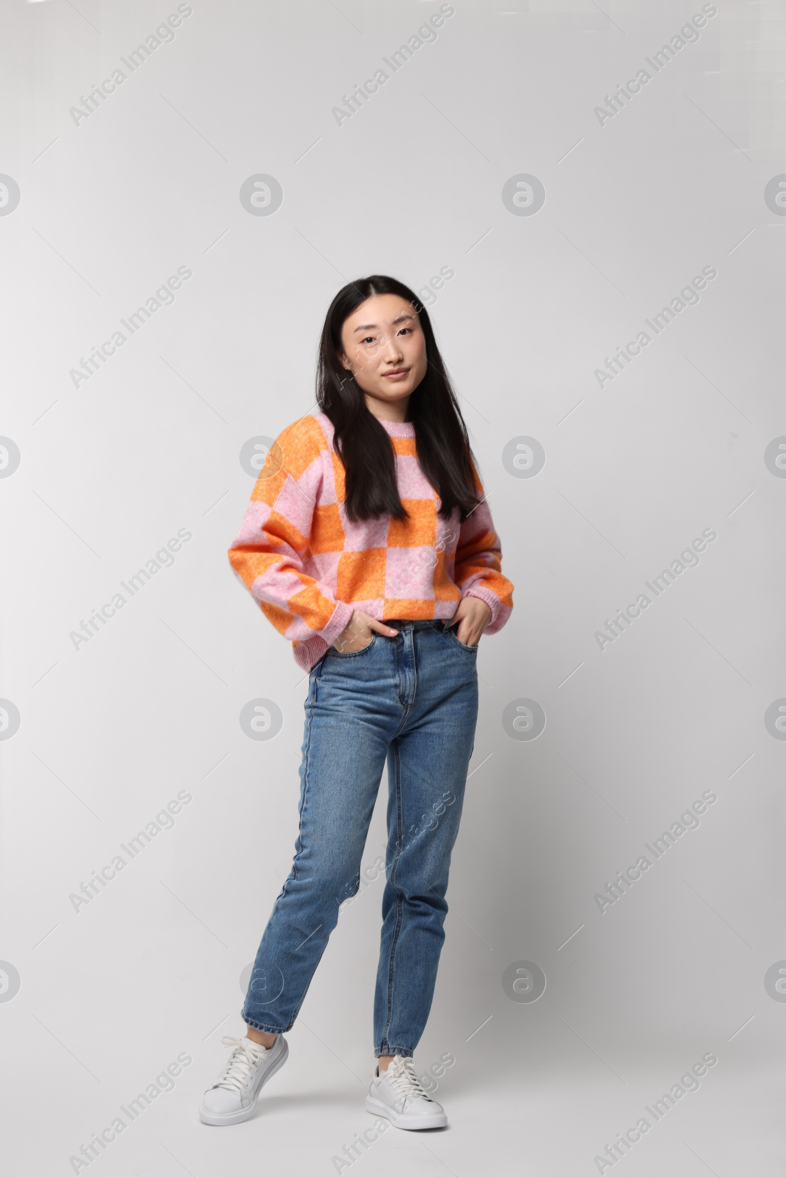 Photo of Full length portrait of beautiful woman on light background