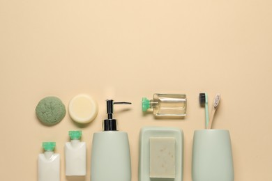 Bath accessories. Flat lay composition with personal care products on beige background, space for text