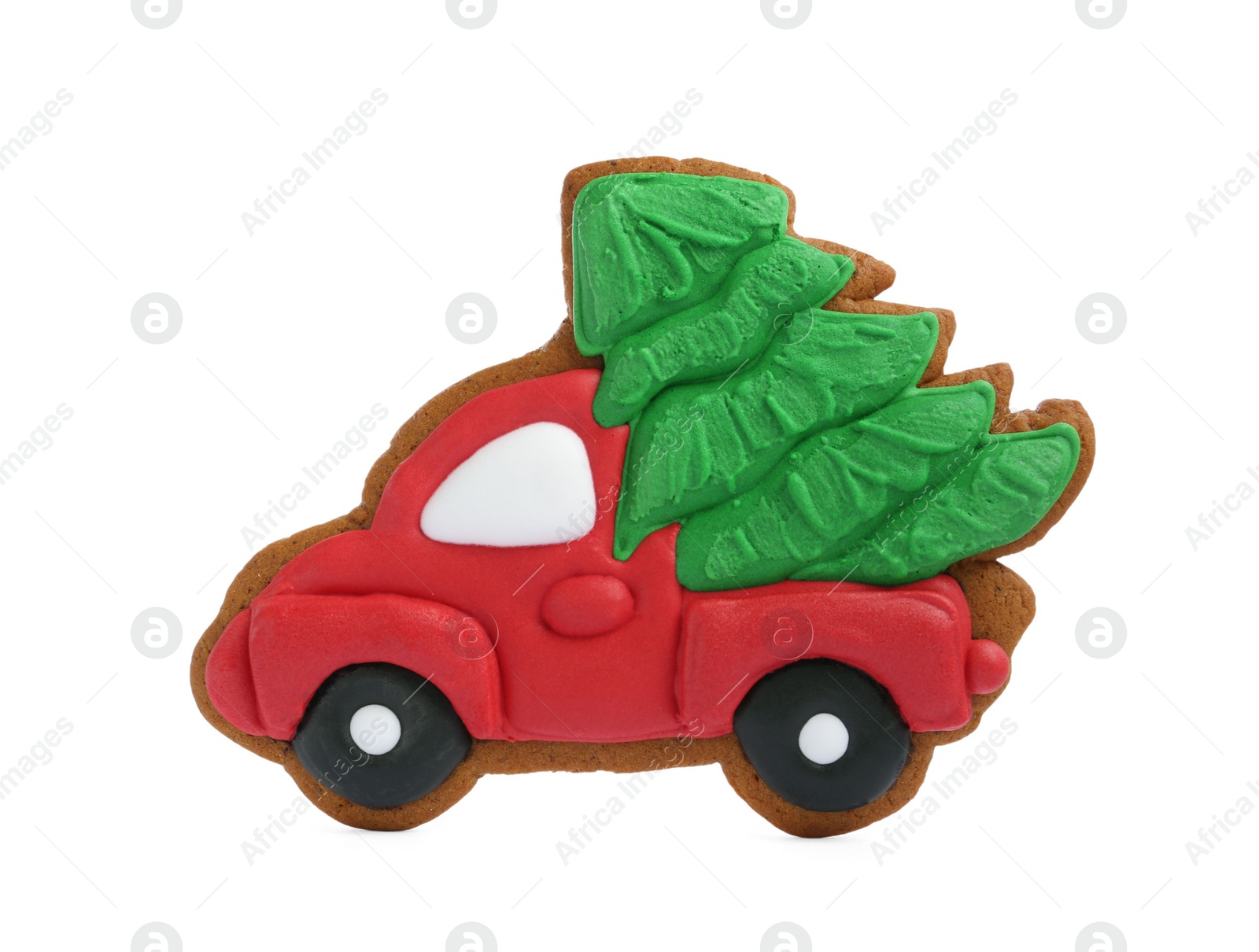 Photo of Christmas cookie in shape of car with fir tree isolated on white