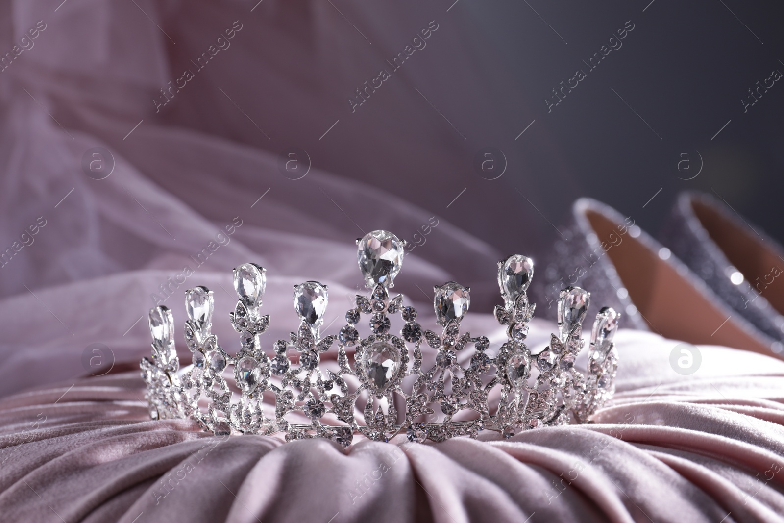 Photo of Beautiful silver tiara with diamonds on light cloth