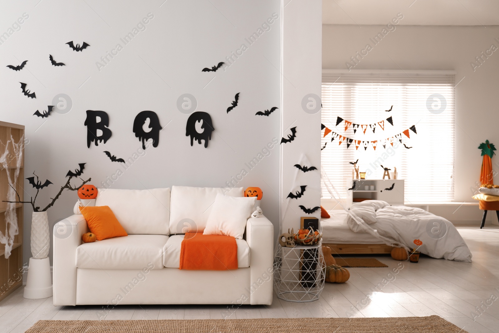 Photo of Stylish room interior with creative Halloween decor