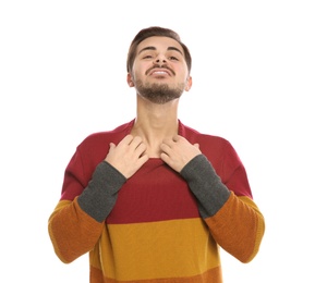 Photo of Young man scratching chest on white background. Annoying itch