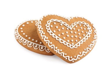 Photo of Gingerbread hearts decorated with icing on white background