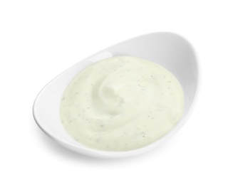 Photo of Bowl of homemade garlic sauce isolated on white