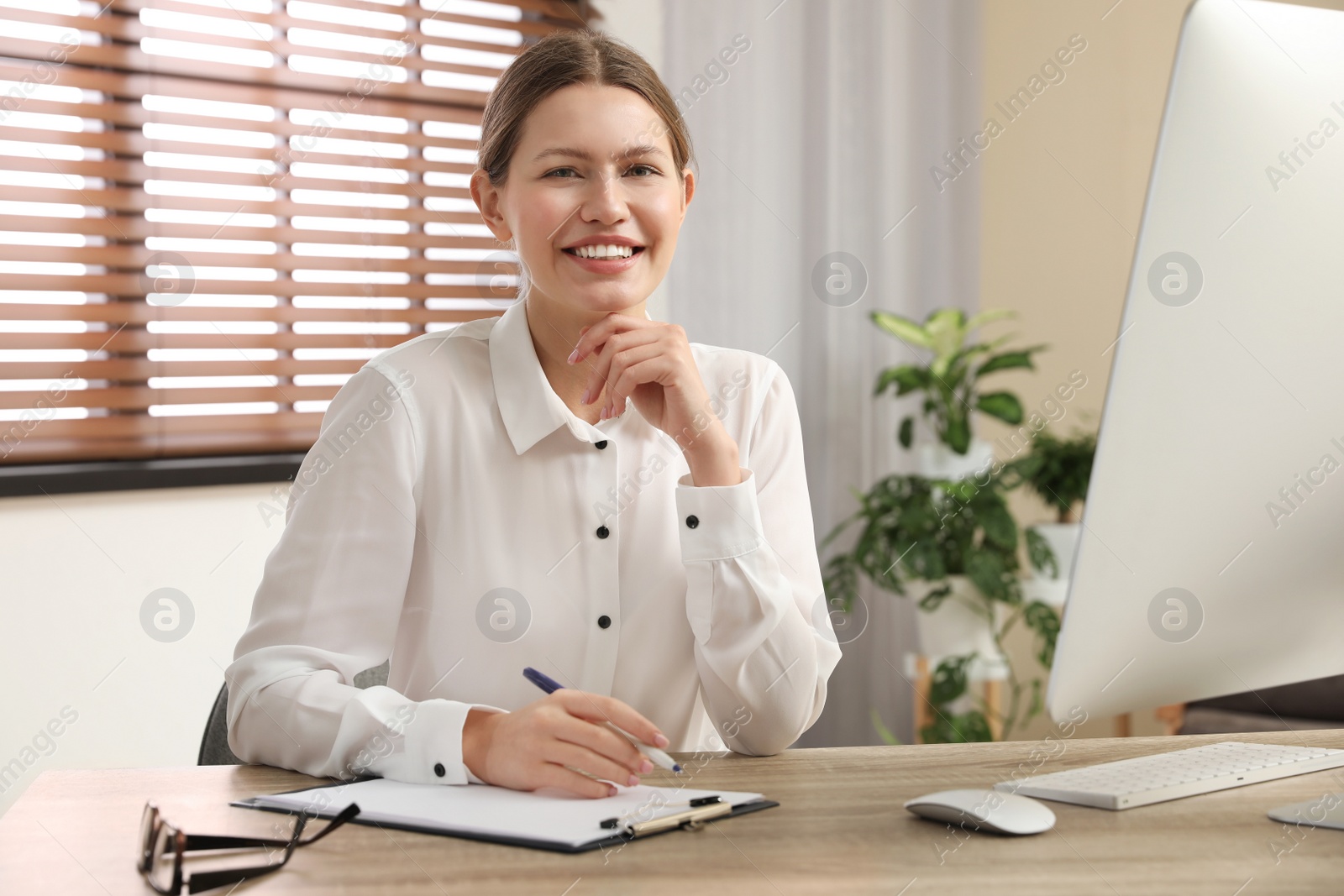 Photo of Professional psychotherapist at table in modern office