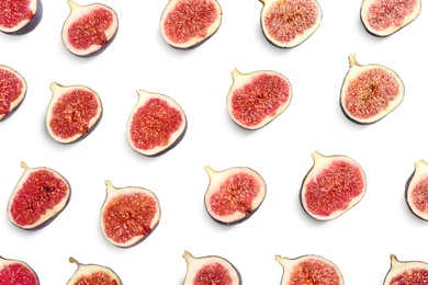 Photo of Cut ripe figs on white background, top view