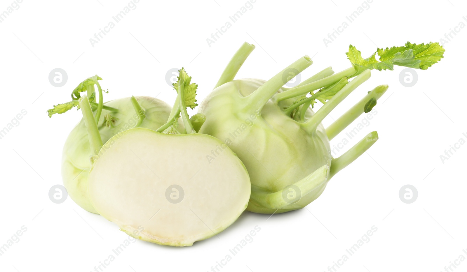 Photo of Whole and cut kohlrabi plants on white background