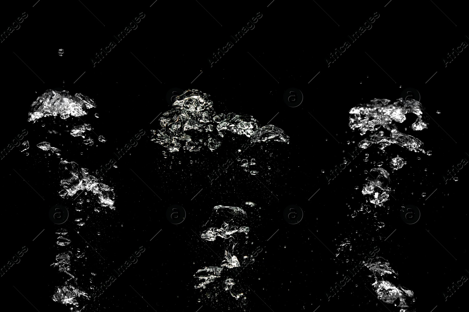 Image of Collage with air bubbles in water on black background