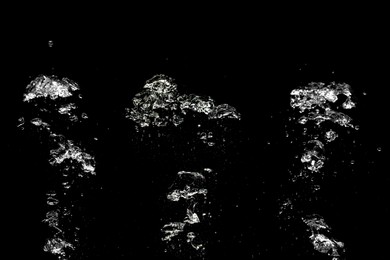 Image of Collage with air bubbles in water on black background