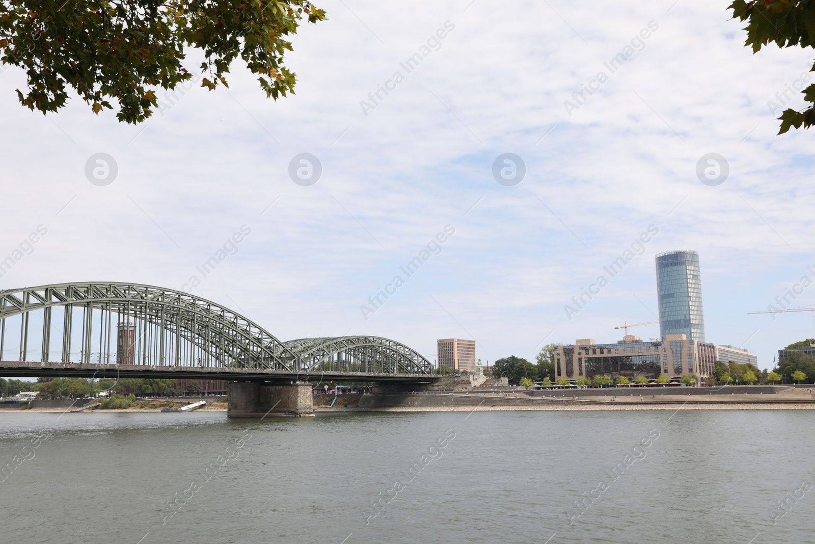 Photo of Cologne, Germany - August 28, 2022: Picturesque view of a modern bridge over river