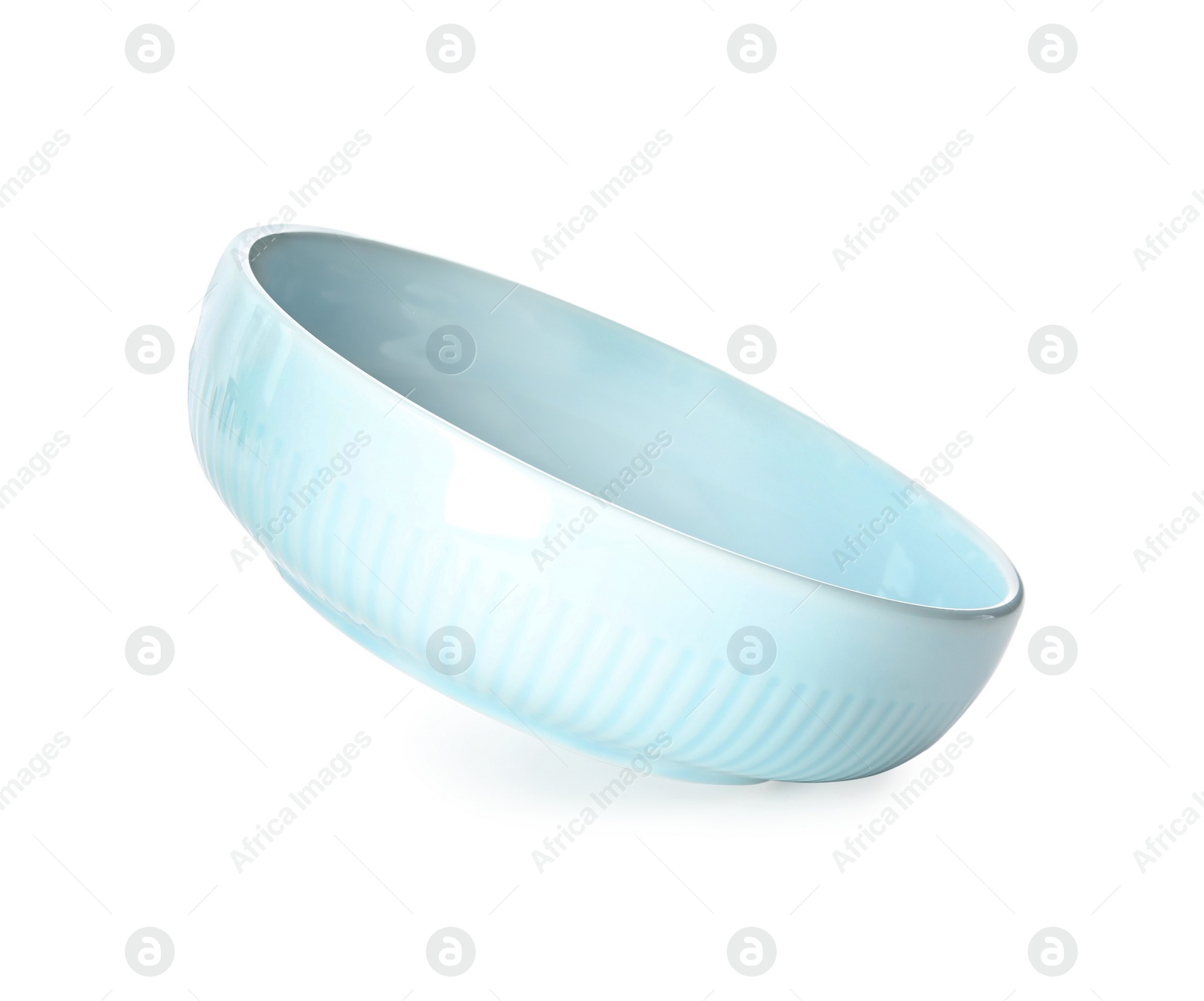 Photo of Clean light blue bowl isolated on white
