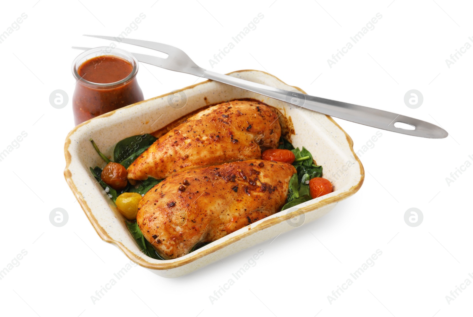 Photo of Baked chicken fillets with vegetables and marinade isolated on white