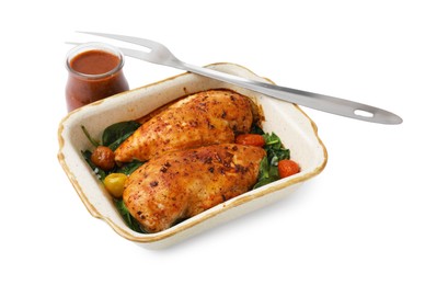 Baked chicken fillets with vegetables and marinade isolated on white