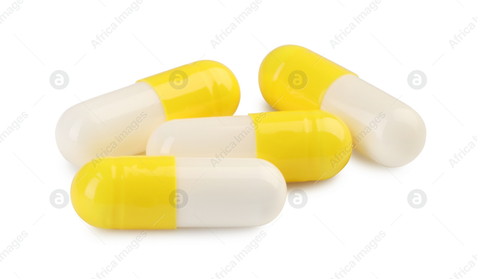 Photo of Many antibiotic pills isolated on white. Medicinal treatment