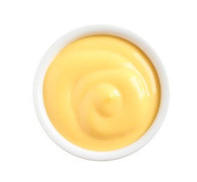 Delicious cheese sauce in bowl on white background, top view