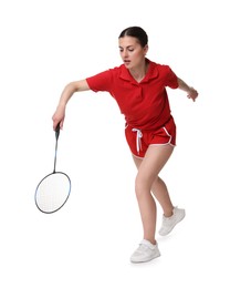 Young woman playing badminton with racket on white background