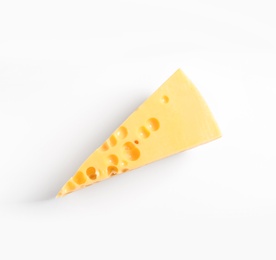 Piece of cheese on white background, top view. Natural food high in protein