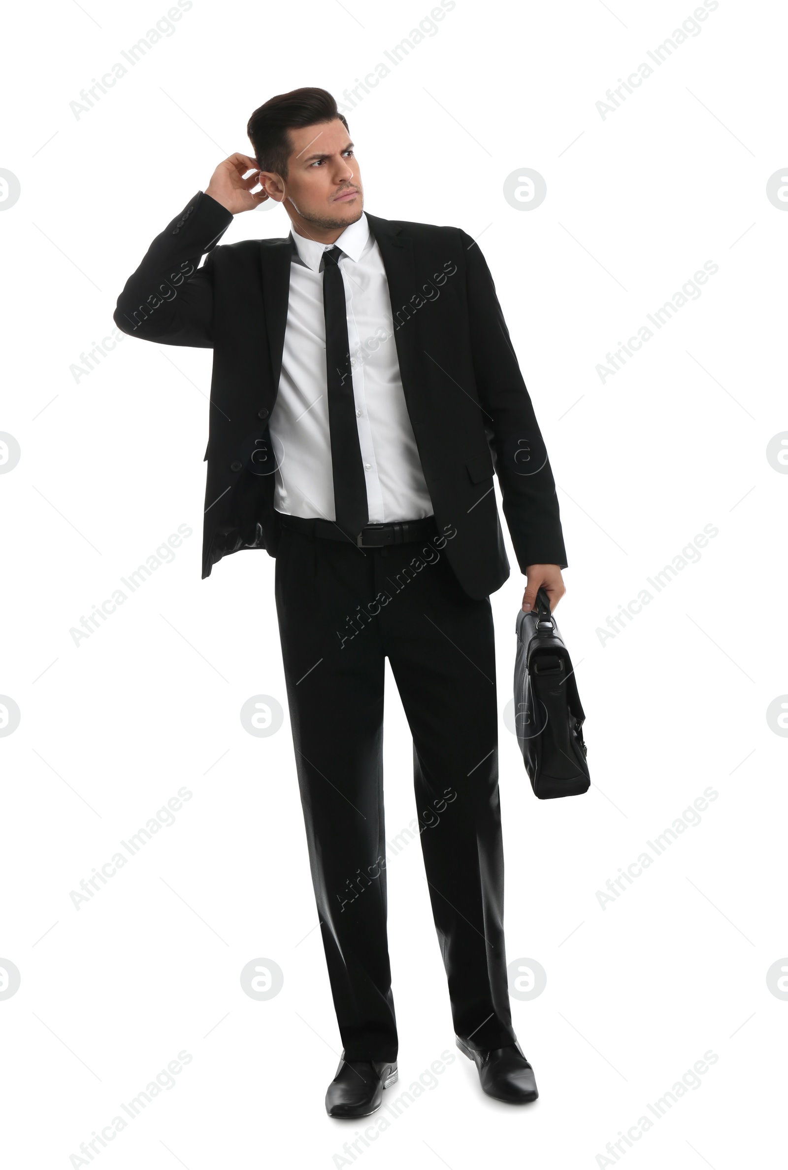 Photo of Thoughtful businessman with suitcase on white background