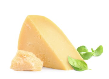 Delicious parmesan cheese and basil on white background