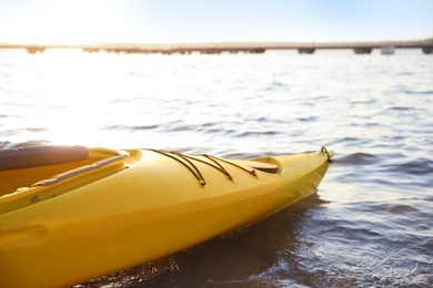 Yellow kayak on river, closeup. Summer camp activity