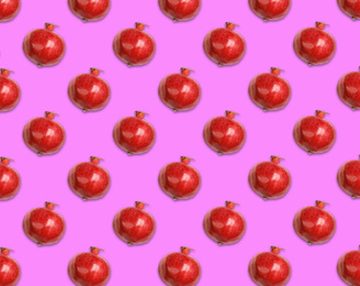 Image of Pattern of red pomegranates on pale fuchsia background