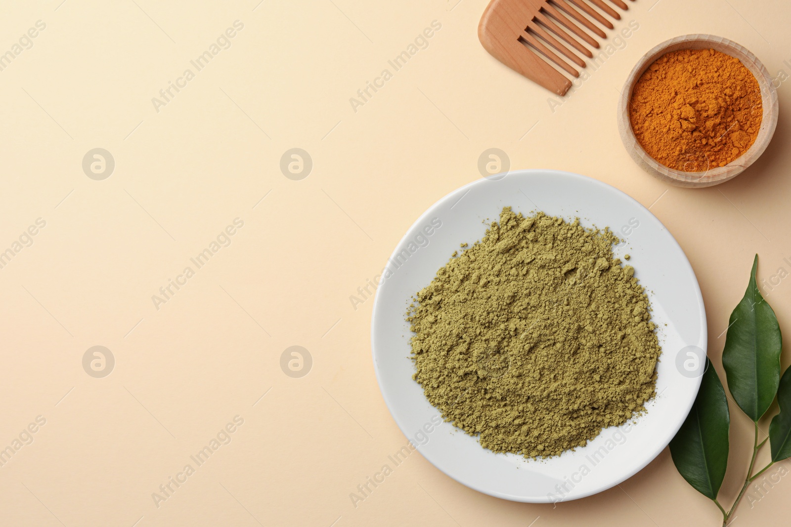 Photo of Flat lay composition with henna and turmeric powder on beige background, space for text. Natural hair coloring