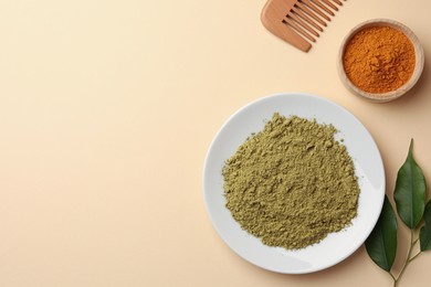 Photo of Flat lay composition with henna and turmeric powder on beige background, space for text. Natural hair coloring