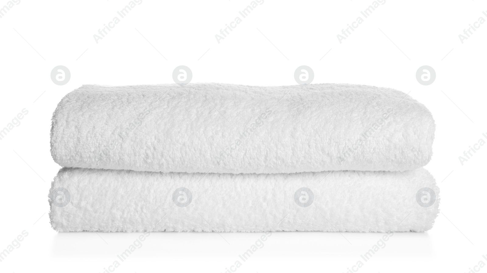 Photo of Stack of clean soft towels on white background