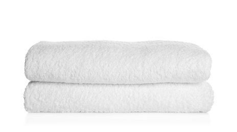 Photo of Stack of clean soft towels on white background