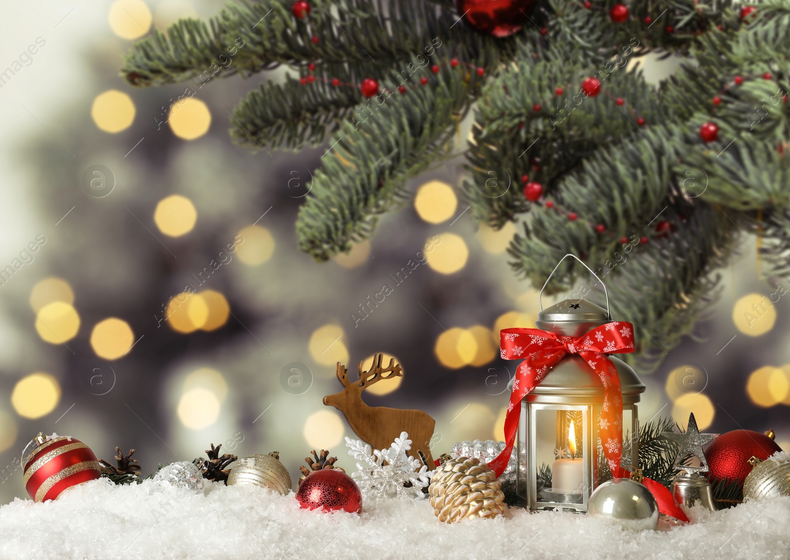 Image of Christmas lantern and decorations on table. Bokeh effect