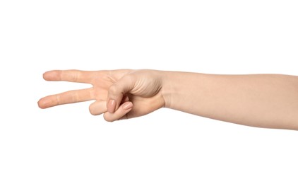 Photo of Playing rock, paper and scissors. Woman making scissors with her fingers on white background, closeup