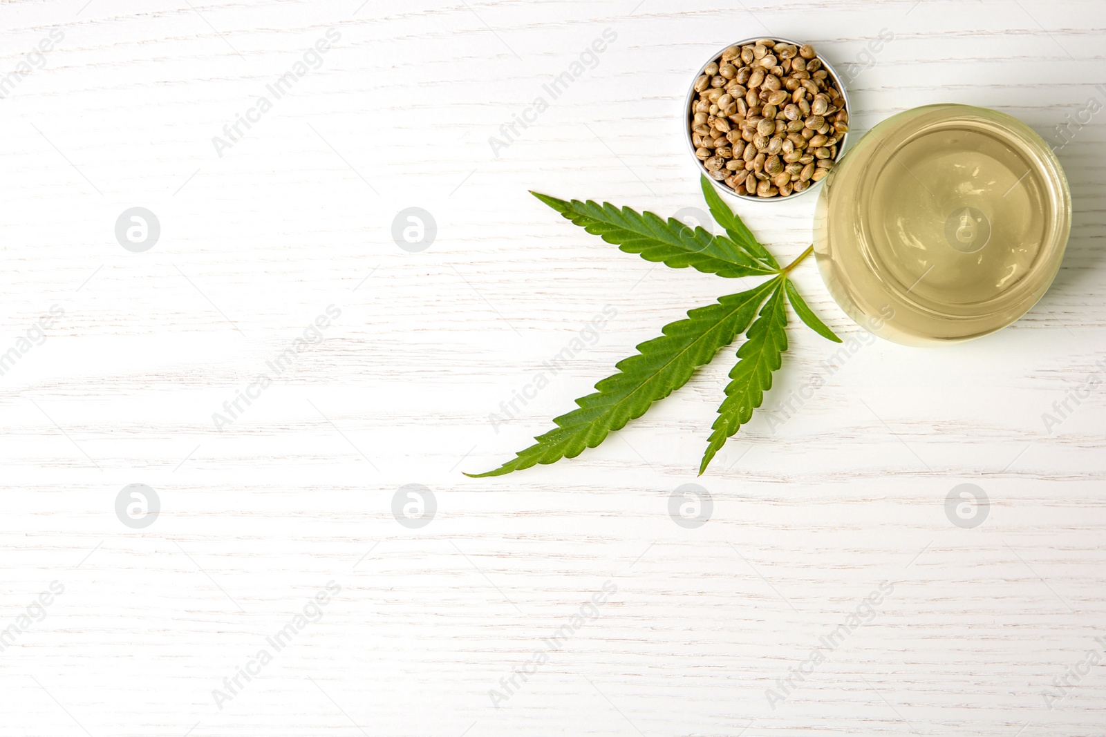 Photo of Flat lay composition with hemp lotion and space for text on white wooden background