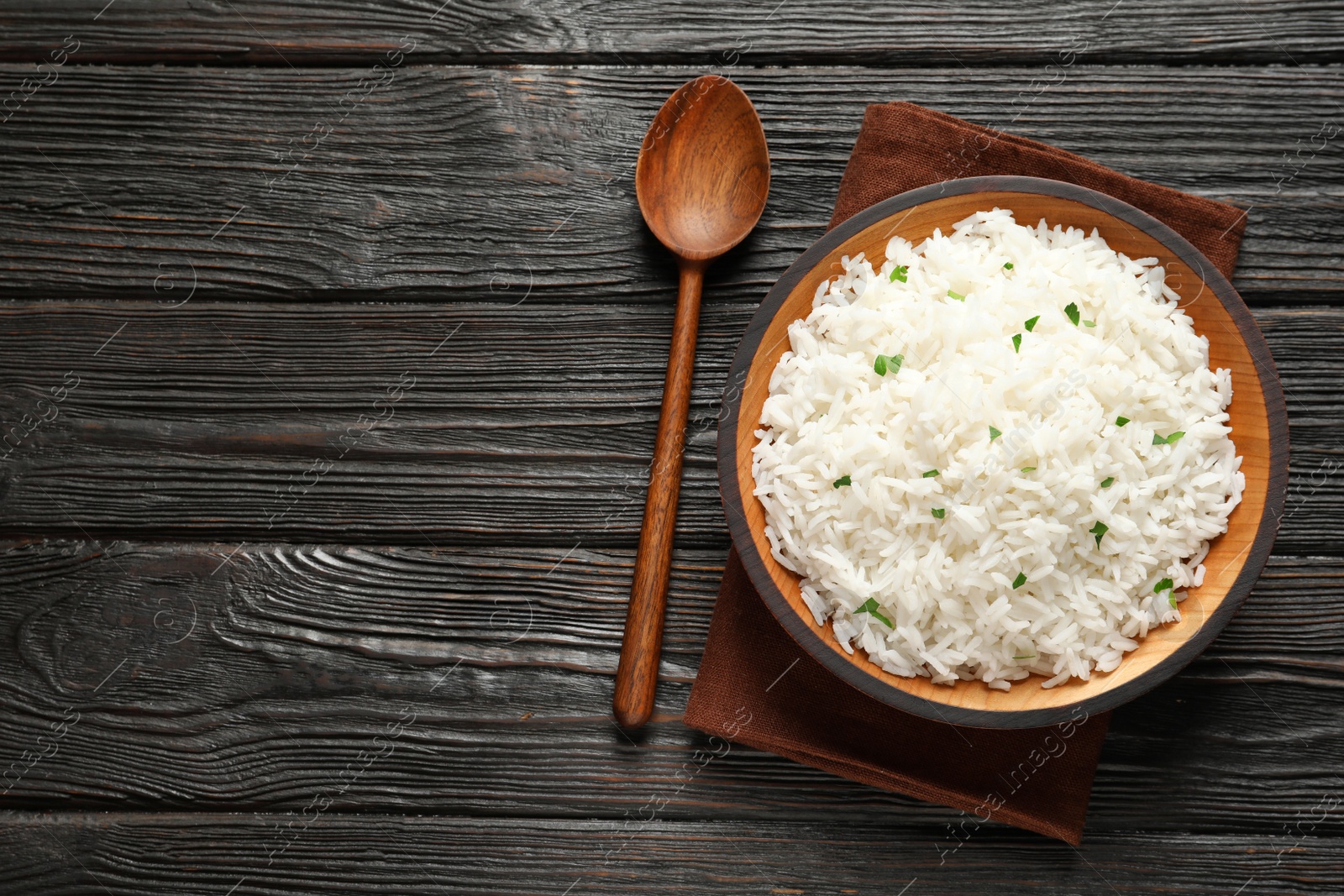 Photo of Plate of tasty cooked rice served on table, flat lay. Space for text