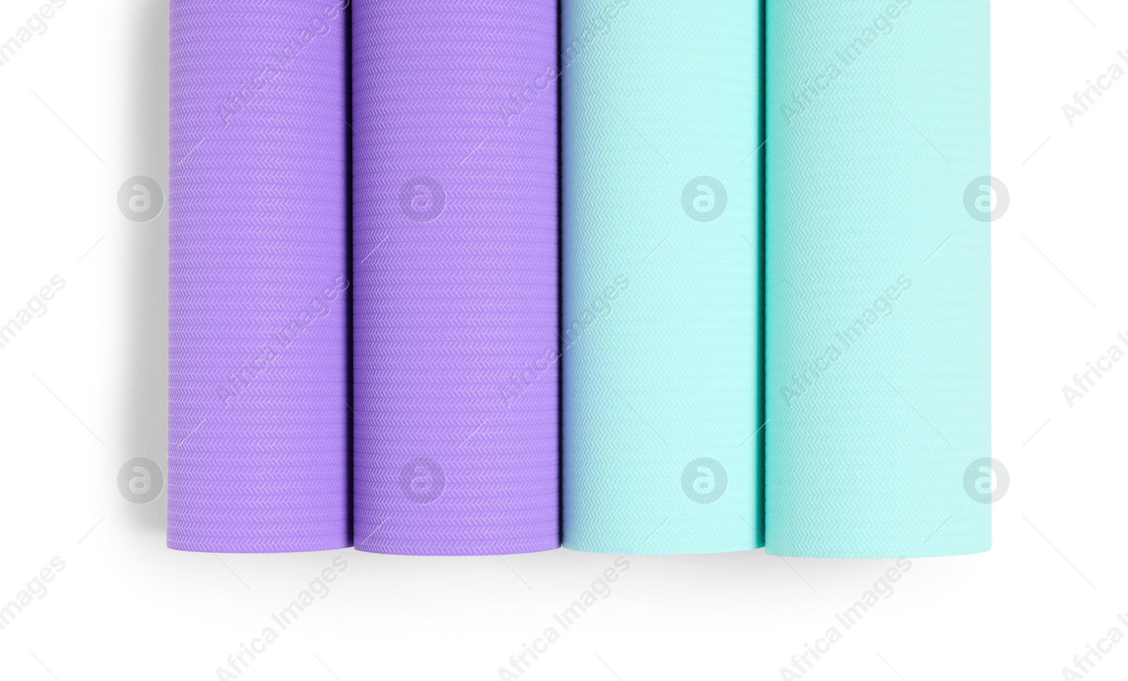 Photo of Colorful wallpaper rolls isolated on white, top view