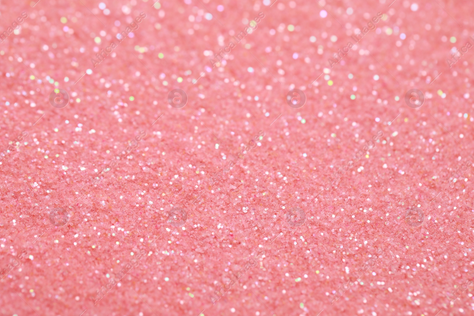 Photo of Beautiful pink shiny glitter as background, closeup