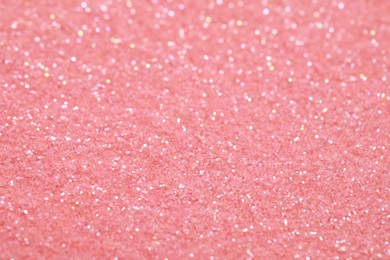 Photo of Beautiful pink shiny glitter as background, closeup