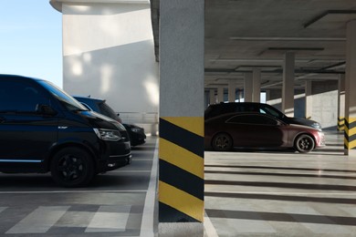 Photo of Outdoor parking lot with cars on sunny day