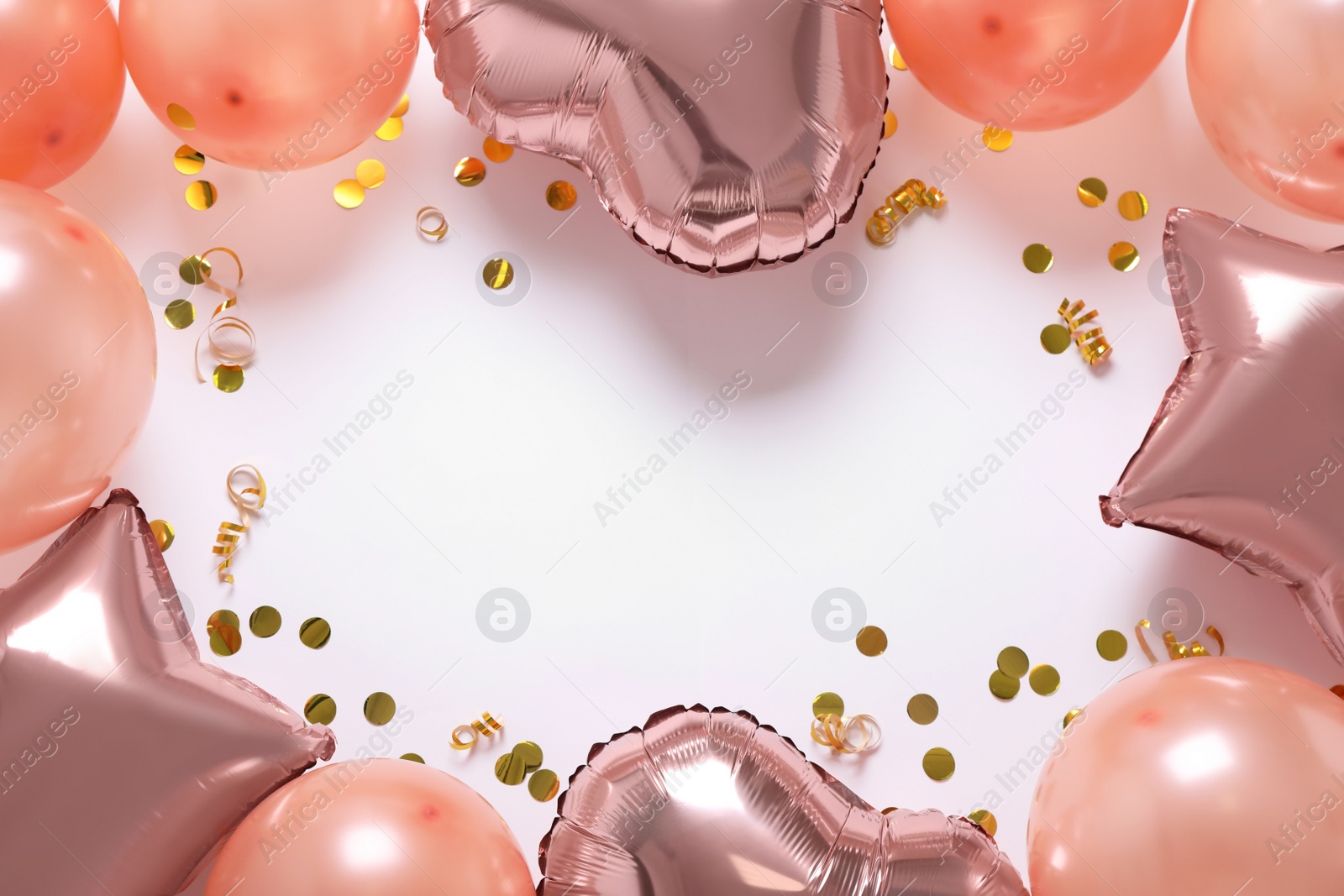 Photo of Frame made of festive balloons on white background, flat lay. Space for text