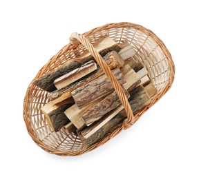 Wicker basket with firewood on white background, top view