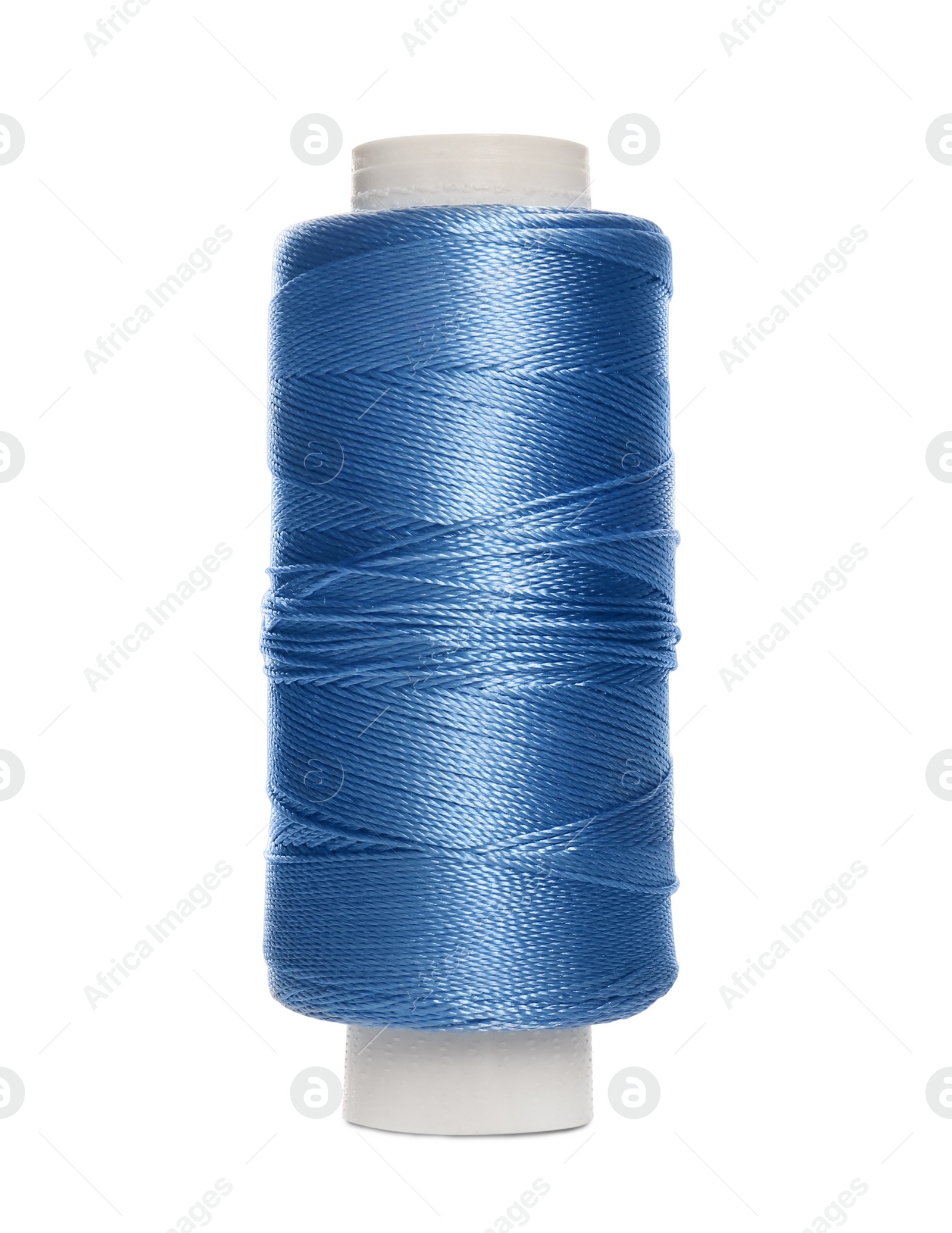 Photo of Spool of light blue sewing thread isolated on white