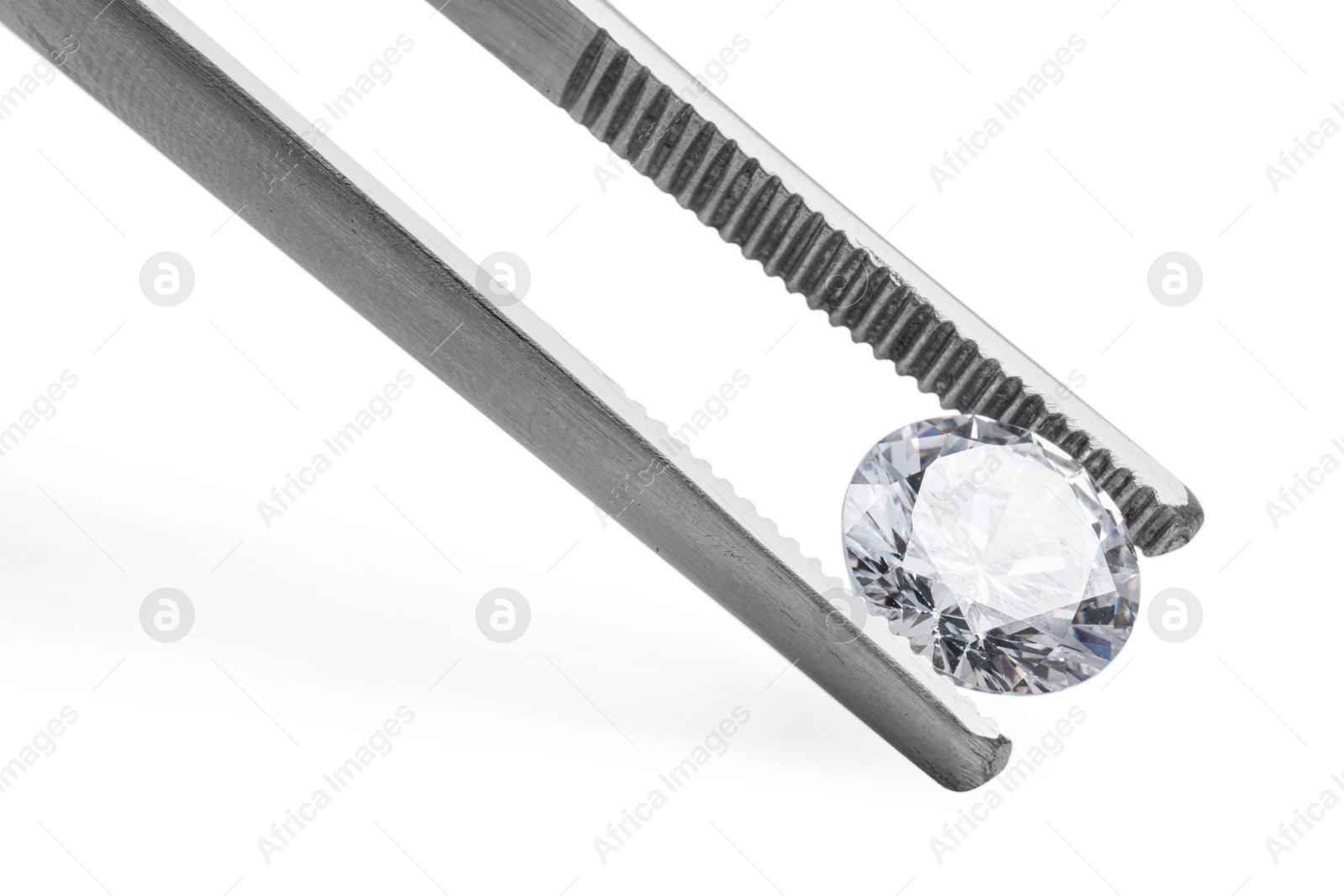 Photo of Tweezers with beautiful shiny diamond isolated on white