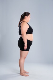 Photo of Overweight woman before weight loss on color background