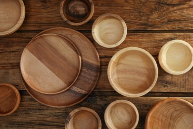 Set of wooden dishware on table, flat lay